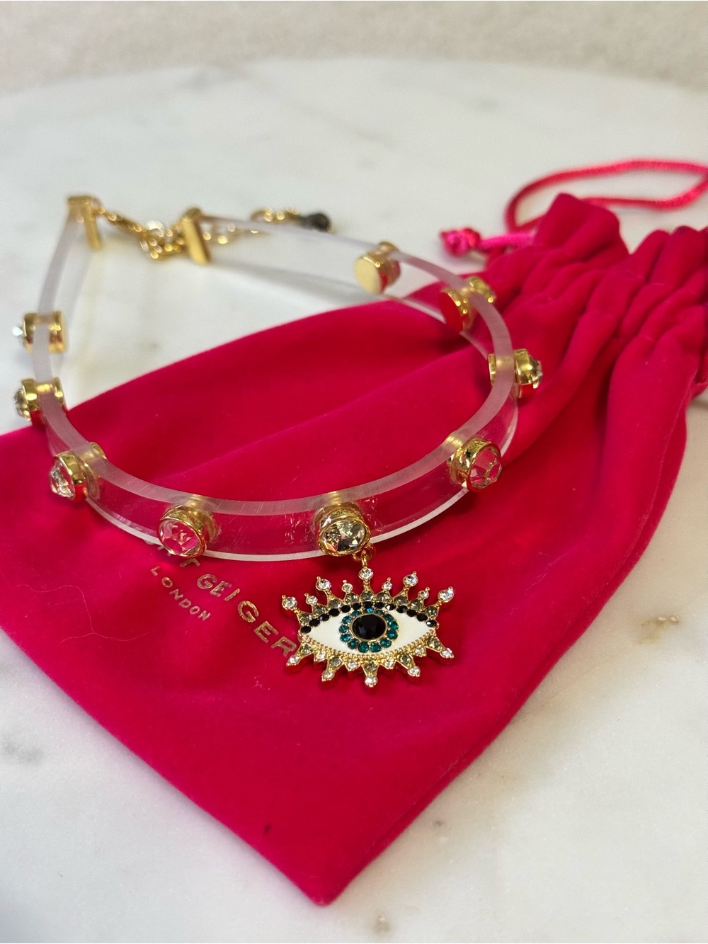 Kurt Geiger- 🦅 Clear Acrylic Choker with Gold and Blue Evil Eye Charm